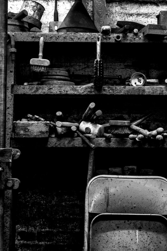grayscale photography of shelf with tools