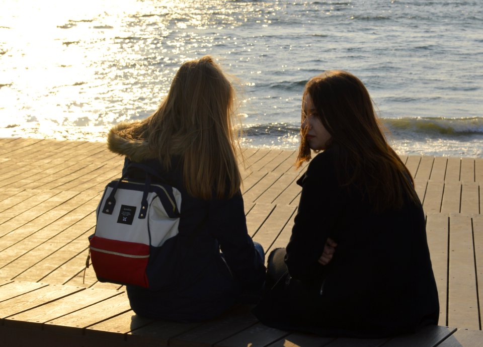Russia, Vladivostok, Teenager girls sitting