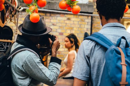 man wearing blue backpack photo