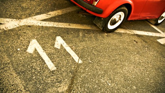 red car on black asphalt road