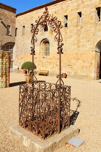 Old well courtyard wrought iron photo