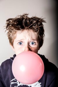 Chewing gum surprised blow bubbles