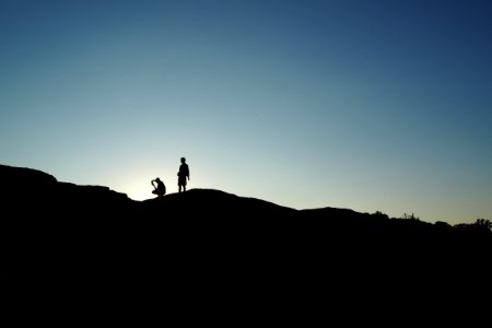silhouette of person on hill