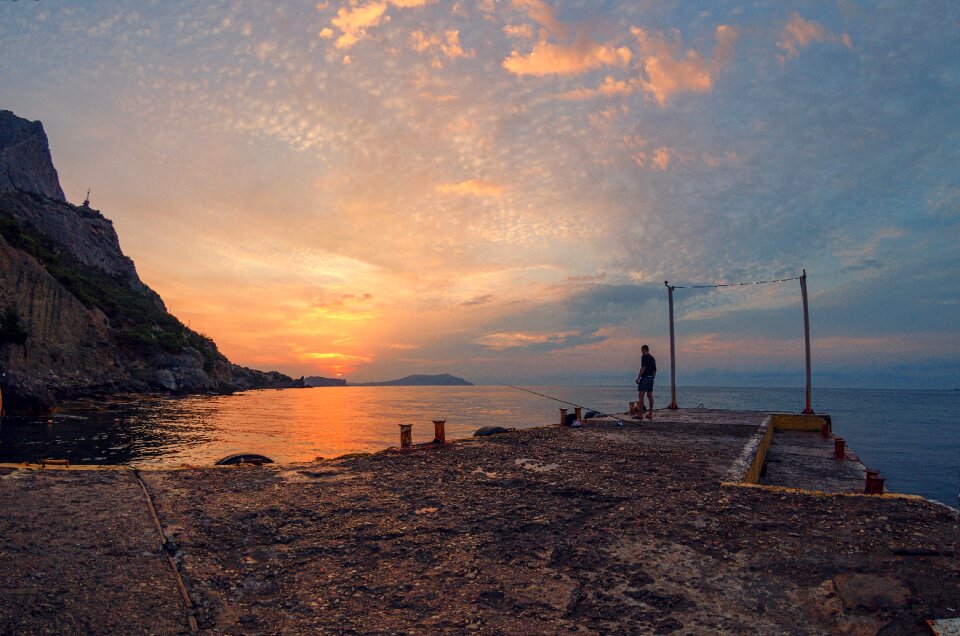 Crimea sunrise fisherman