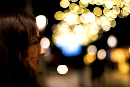 woman facing boke lights photo