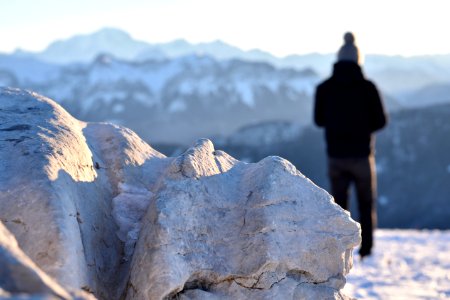 man standing on snow covered ground