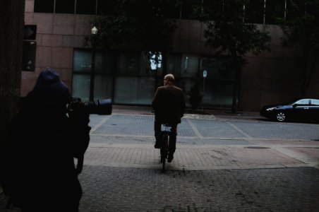 man riding bicycle photo