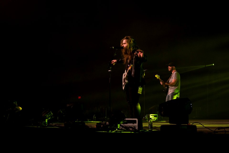 man and woman performing on stage