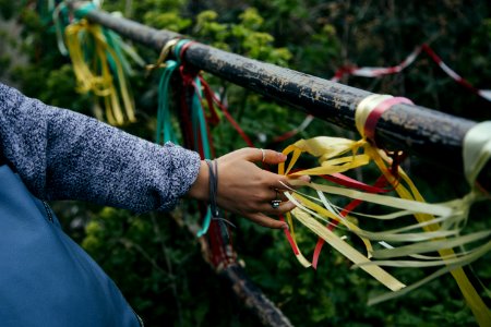 person holding white and red rope