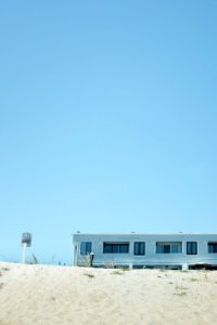 white and blue house under blue sky during daytime photo