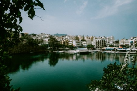 buildings near body of water during day photo