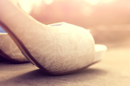 white heeled shoe close-up photography