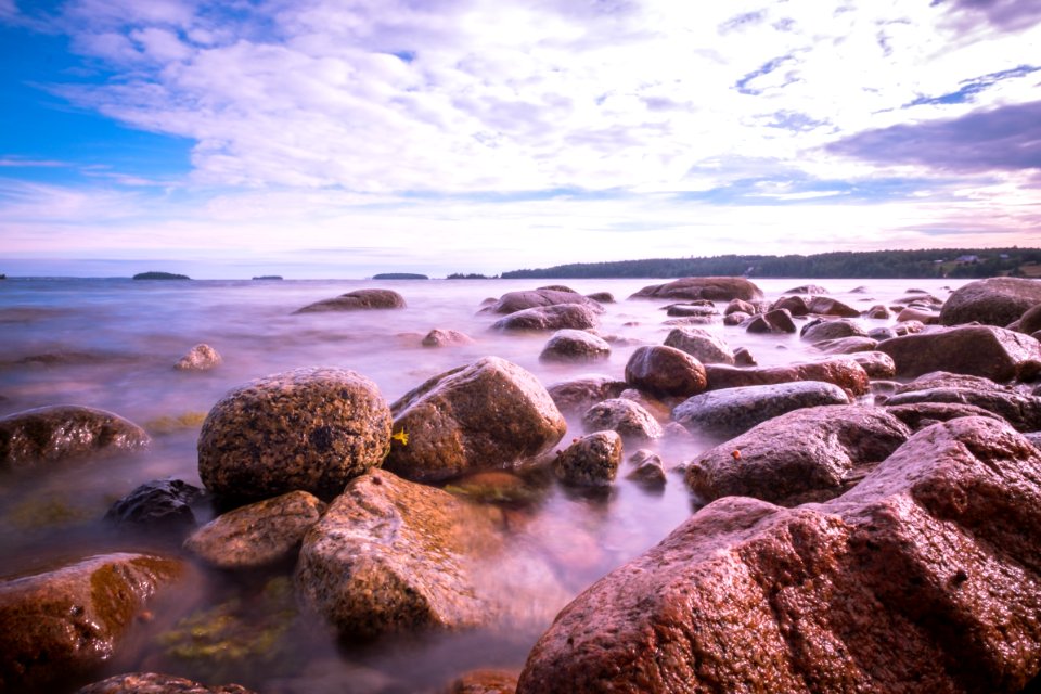 brown rocks beside beach
