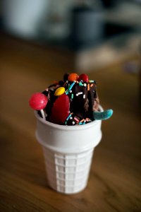 ice cream with sprinkles on white cup photo