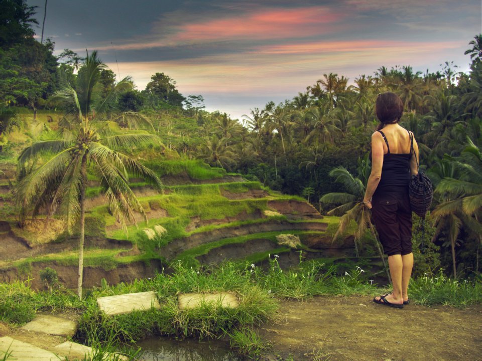 woman standing wearing black cami top during daytime