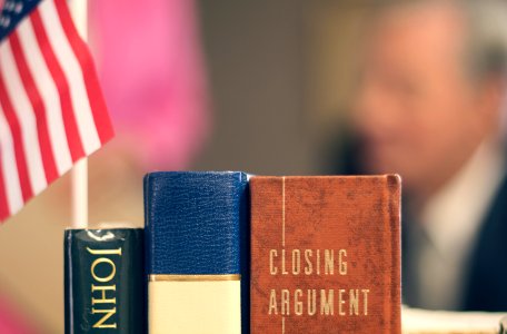 Books and an American flag in front of a judge. photo