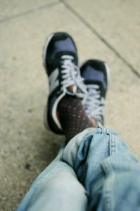 person wearing sneakers photo