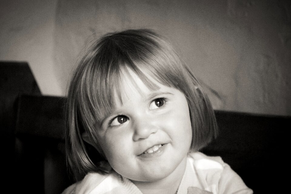 Baby girl black white happy
