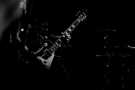 Bass player in black and white photo