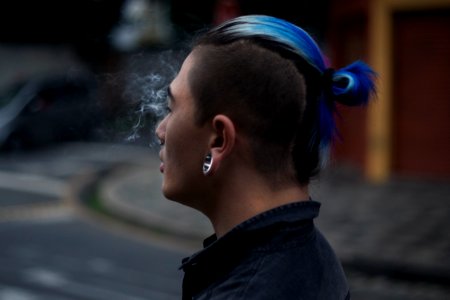 Blue bun with shaved head 