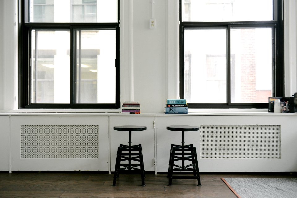 Book stacks on a windowsill 