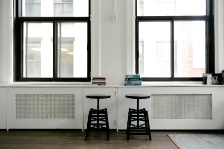 Book stacks on a windowsill 