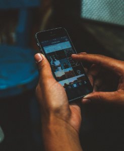 Browsing photos on a phone (cropped) 