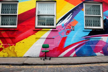 Chair in front of graffiti photo