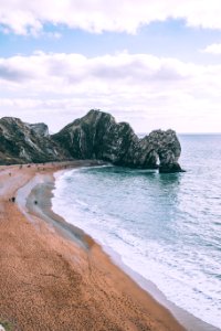 Cliffs on sand beach photo