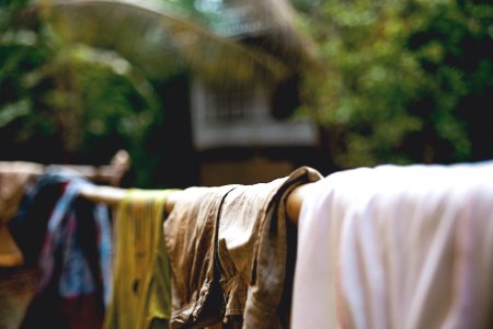 Clothing drying on bamboo pole 