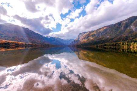 Clouds mirrored in a mountain lake photo