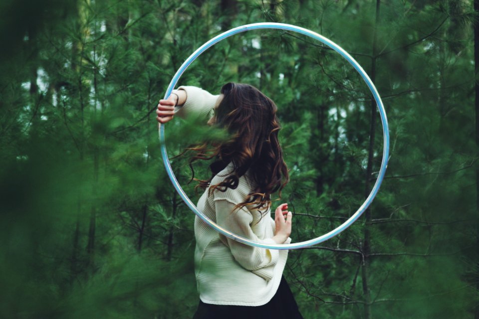 Hula hoop in green woods 