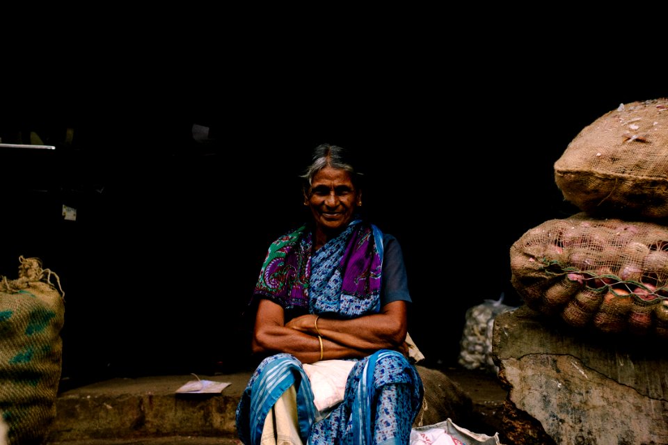 Old woman sitting and smiling 