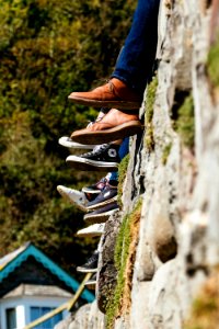 People sat on a wall - Shoes and Converse photo