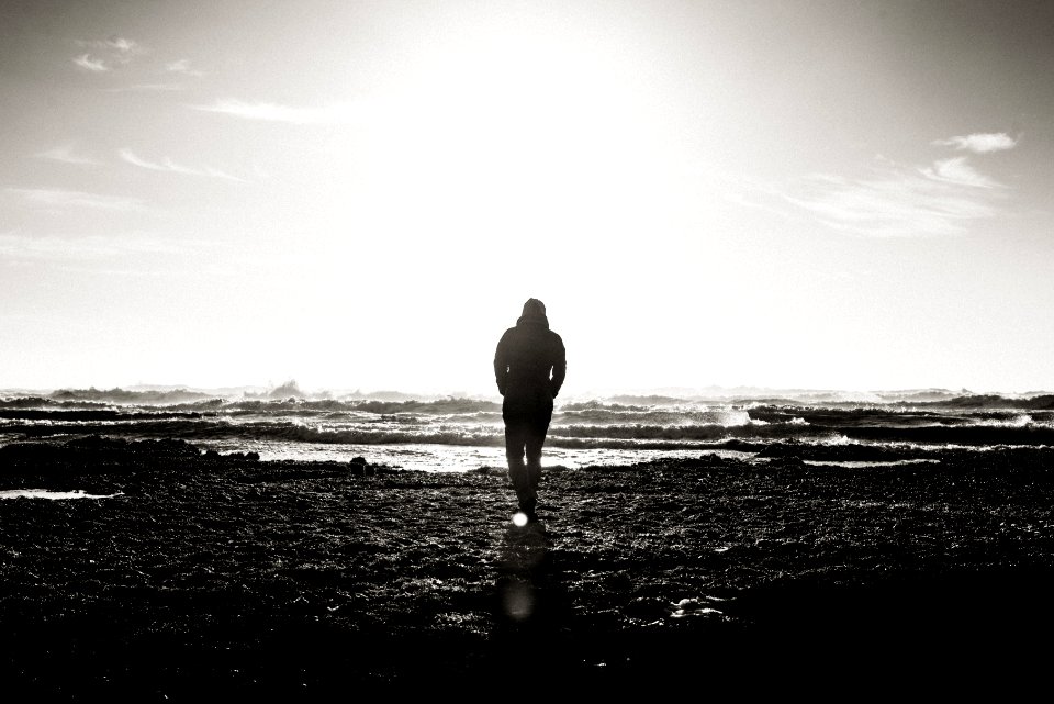 Person walks towards water 