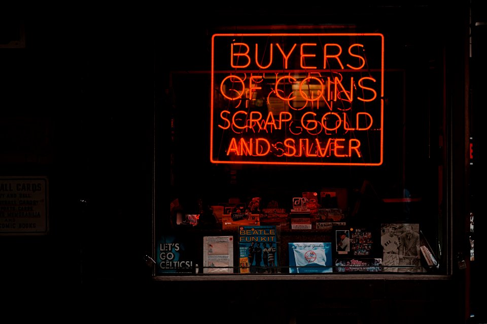 Red neon coin sign 