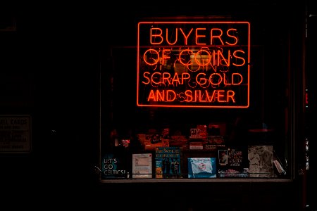 Red neon coin sign 