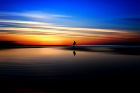 Reflecting colorful beach sunset 
