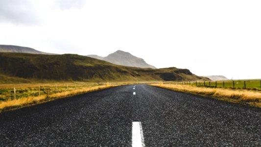 Road through Icelandic hills photo