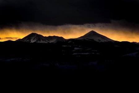 Setting sun behind mountains in Silverthorne photo