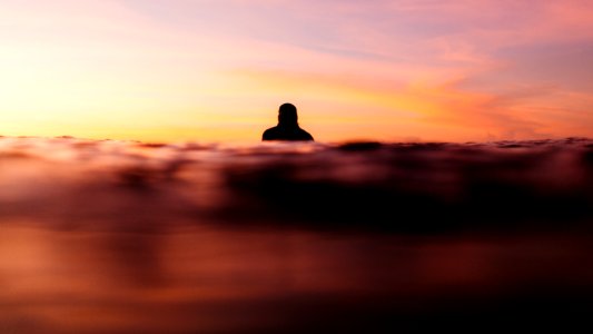 Silhouette in the sea at sunset 