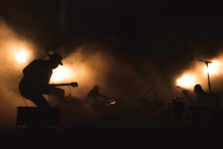 Silhouettes on a dark stage photo