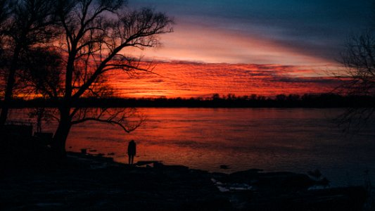Silhouettes in a lakeshore sunset 