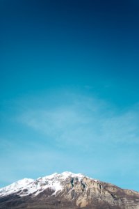 Snowy Mountain In Front Of Blue Sky photo