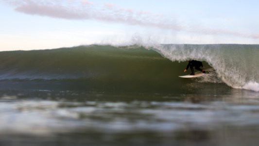 Surfer under the wave 