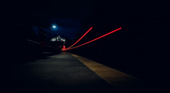 Two red light trails at night 