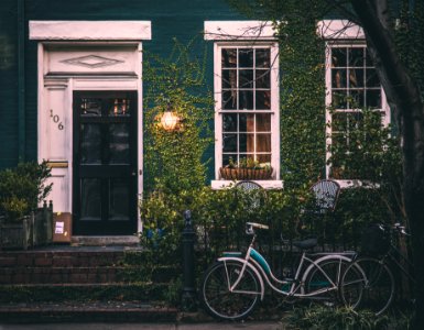 Two bicycles near a house 