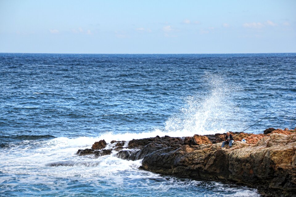 Coast surf fisherman