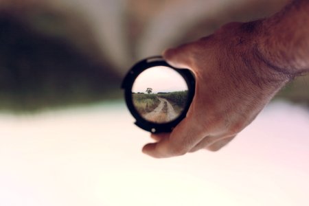 Person Holding Lens Focus Photography