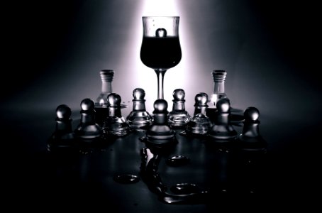 Clear Glass Chess Piece and Wine Glass photo